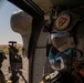 U.S. Army Door Gunner looks off at UH-60M Blackhawk