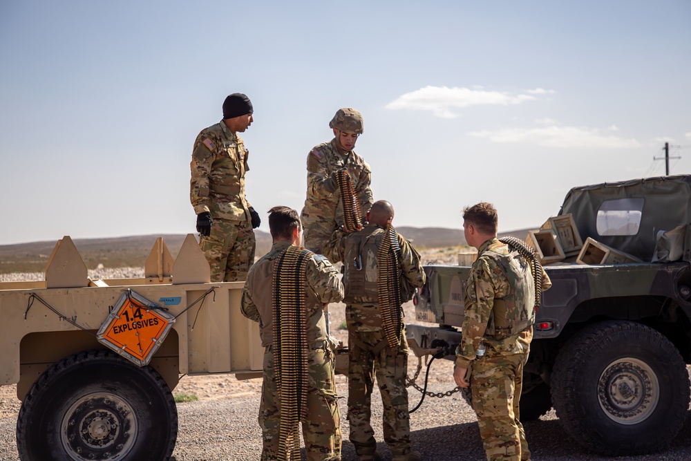 U.S. Army UH-60M Blackhawk crews grab ammunition