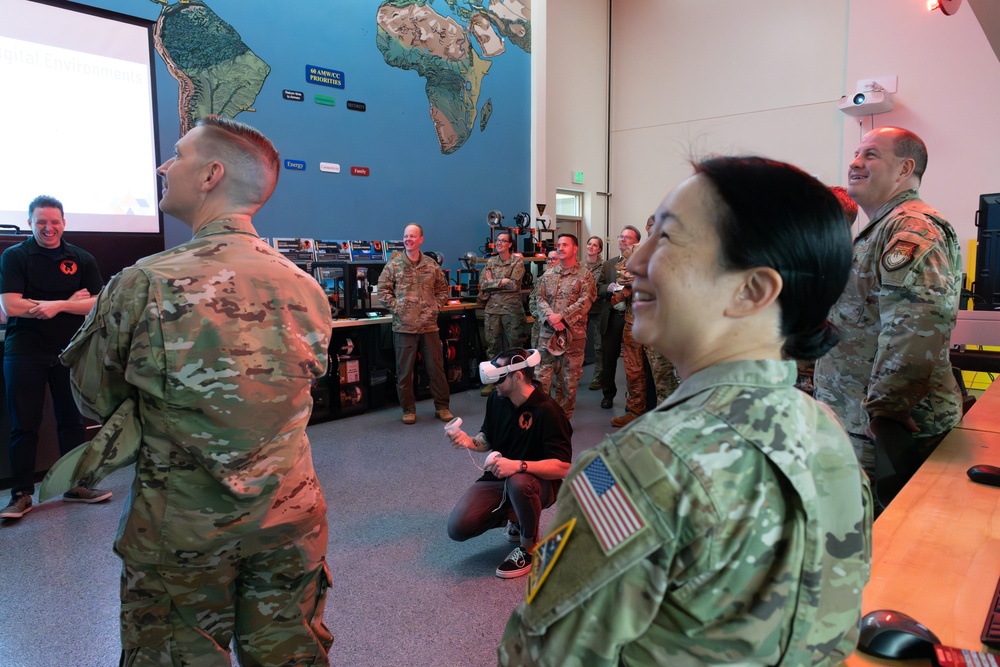 Department of the Air Force California Installation Commanders' Caucus attendees watch a 3D virtual training demonstration