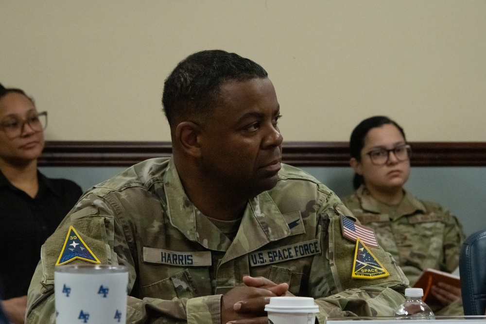 U.S. Air Force Chief Master Sgt. Johnny Harris listens to a briefing during the Department of the Air Force California Installation Commanders' Caucus