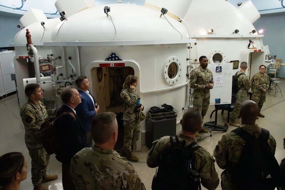 U.S. Air Force Senior Airman Justus Nyakundi, briefs Department of the Air Force California Installation Commanders' Caucus attendees.