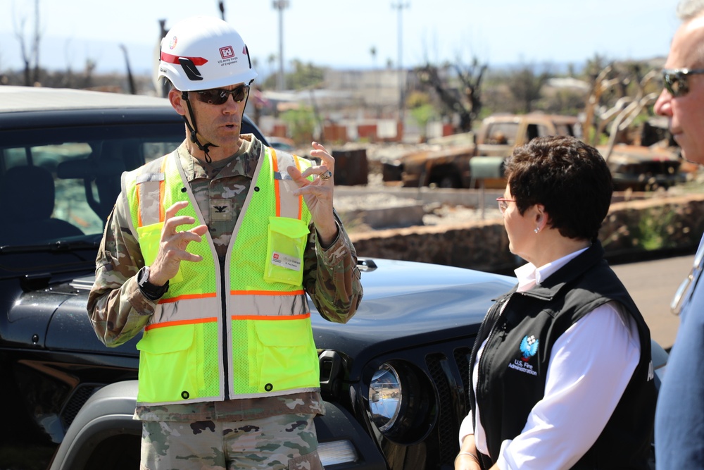 Col. Eric Swenson briefs visitors during Lahaina site visit