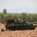 Soldiers wait for orders atop M1129