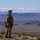 U.S. Army Soldier overlooks mountain range during NTC 24-04