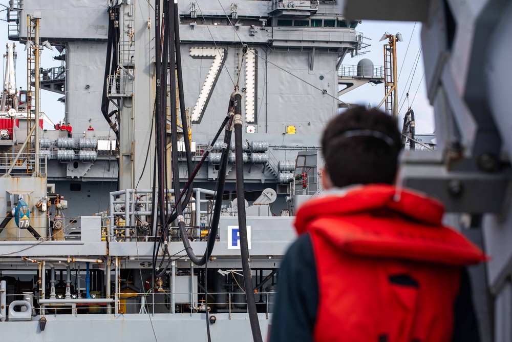 USS Russell (DDG 59) refuels alongside USS Theodore Roosevelt (CVN 71)