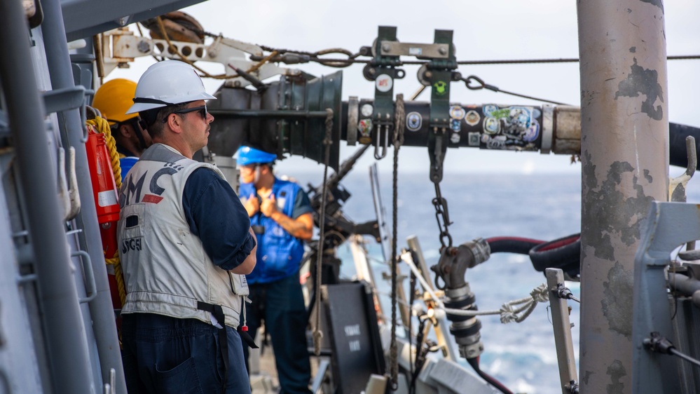 USS Russell (DDG 59) refuels alongside USS Theodore Roosevelt (CVN 71)