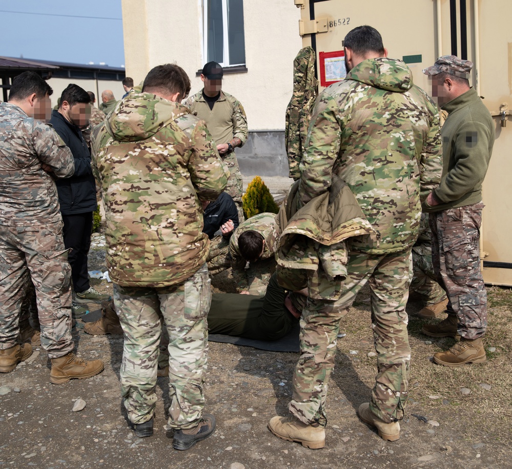 Romanian special operations forces soldiers conduct tactical combat casualty care with MARSOC Marines at Trojan Footprint 24