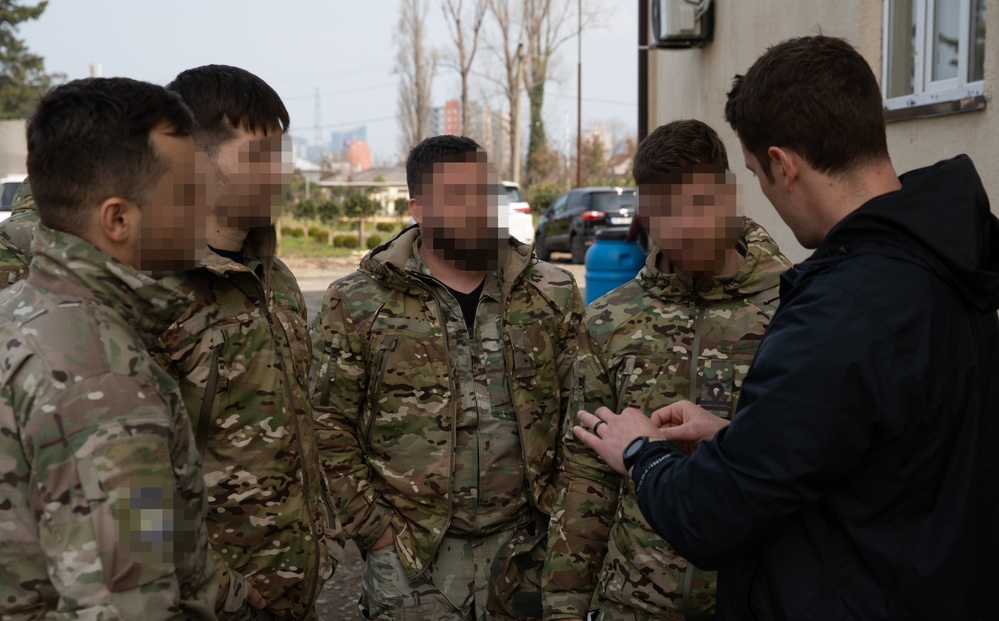 Romanian special operations forces soldiers conduct tactical combat casualty care with MARSOC Marines at Trojan Footprint 24
