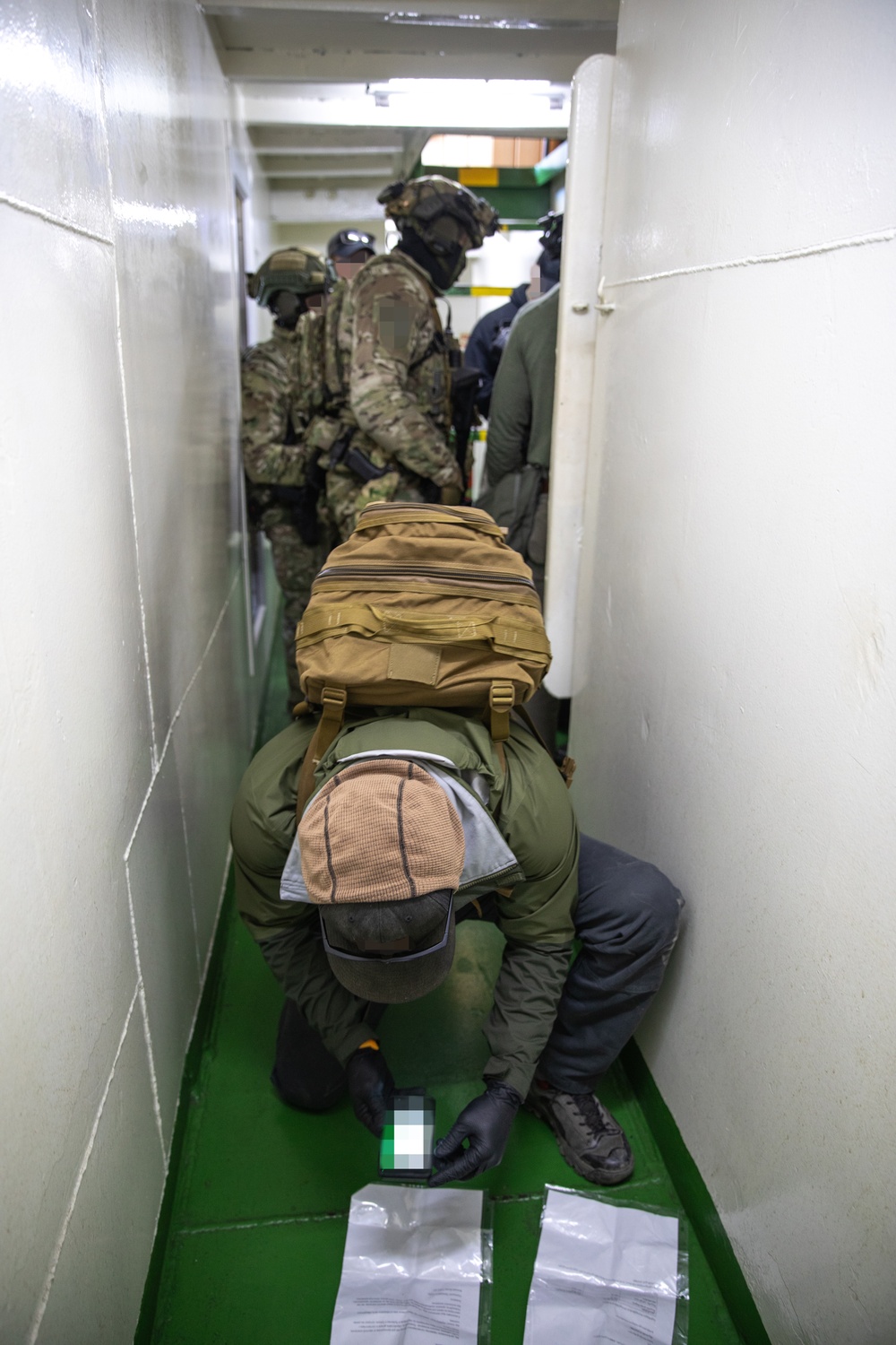 U.S. MARSOC Marines assist in tactical site exploitation of a simulated seized vessel with Georgian Coast Guard and Georgian special operations forces soldiers during Trojan Footprint 24