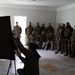 A U.S. MARSOC Marine Raider instructs Georgian and Spanish special operations forces soldiers on demolition tactics during Trojan Footprint 24