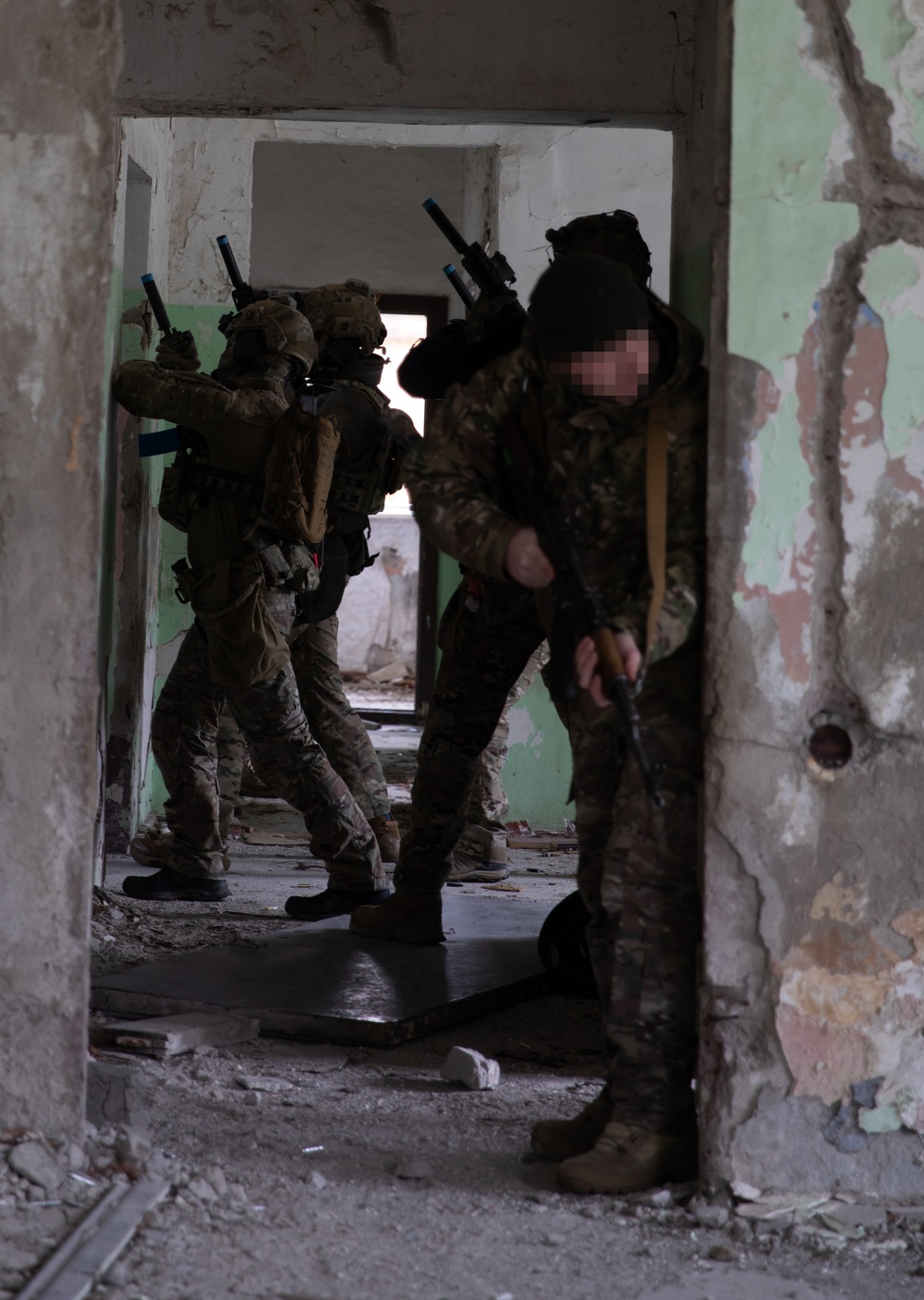 Georgian, and Spanish special operations forces soldiers train to clear a compound during Trojan Footprint 24