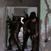 Georgian, and Spanish special operations forces soldiers train to clear a compound during Trojan Footprint 24