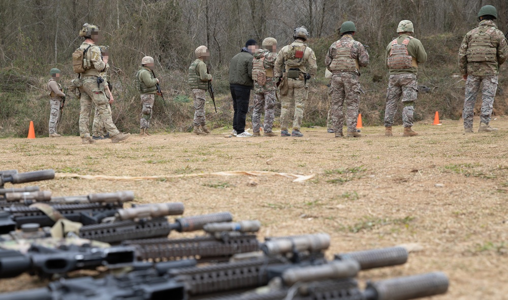 U.S. MARSOC Marine Raiders instruct Georgian, and Spanish special operations forces soldiers on 25 meter rifle engagements during Trojan Footprint 24