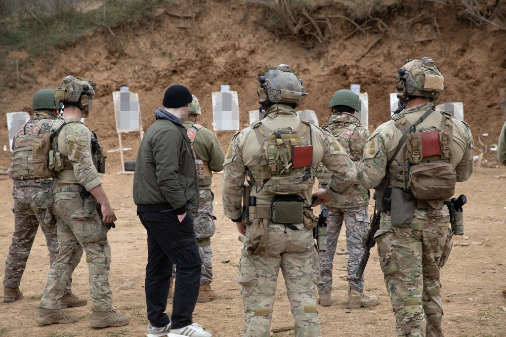 U.S. MARSOC Marine Raiders instruct Georgian, and Spanish special operations forces soldiers on 15 meter pistol engagements during Trojan Footprint 24