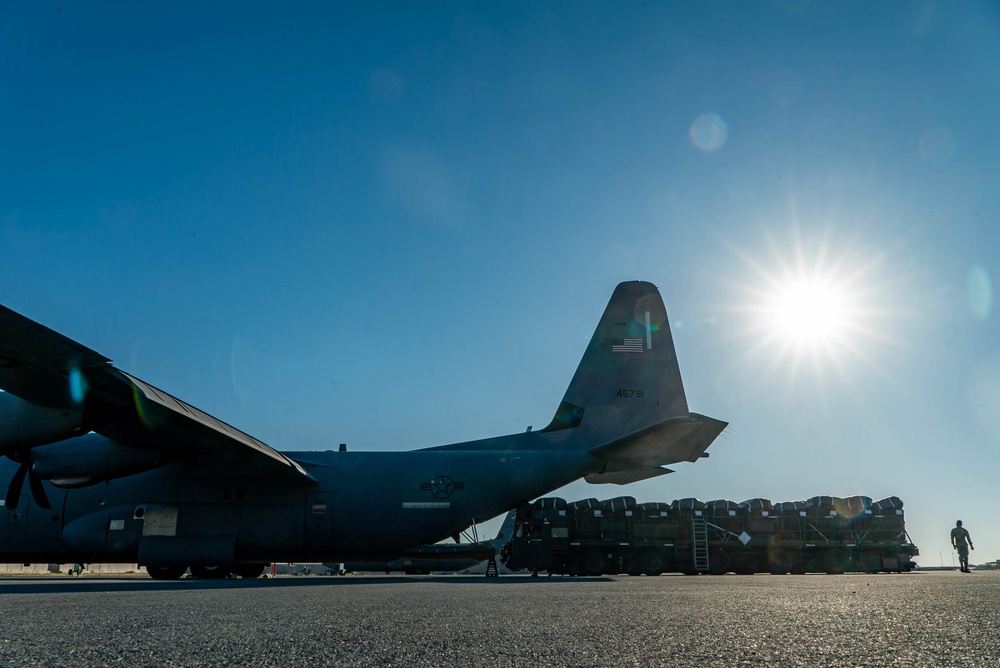 Airmen load AFCENT C-130s with humanitarian aid bound for Gaza