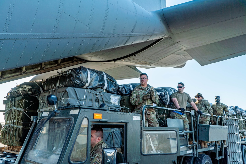 Airmen load AFCENT C-130s with humanitarian aid bound for Gaza