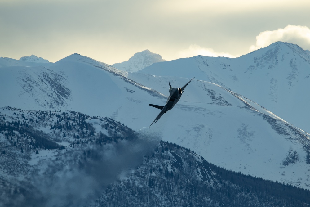 F-22 Raptors fly over JBER