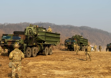U.S., ROK Soldiers prepare bridging system to cross river