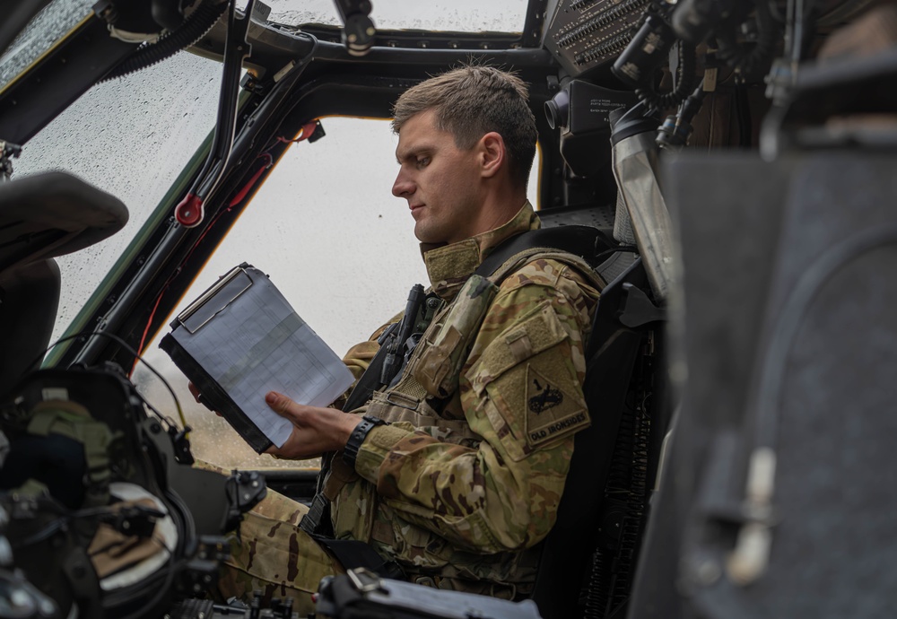 U.S. Army Pilot conducts pre-flight checks