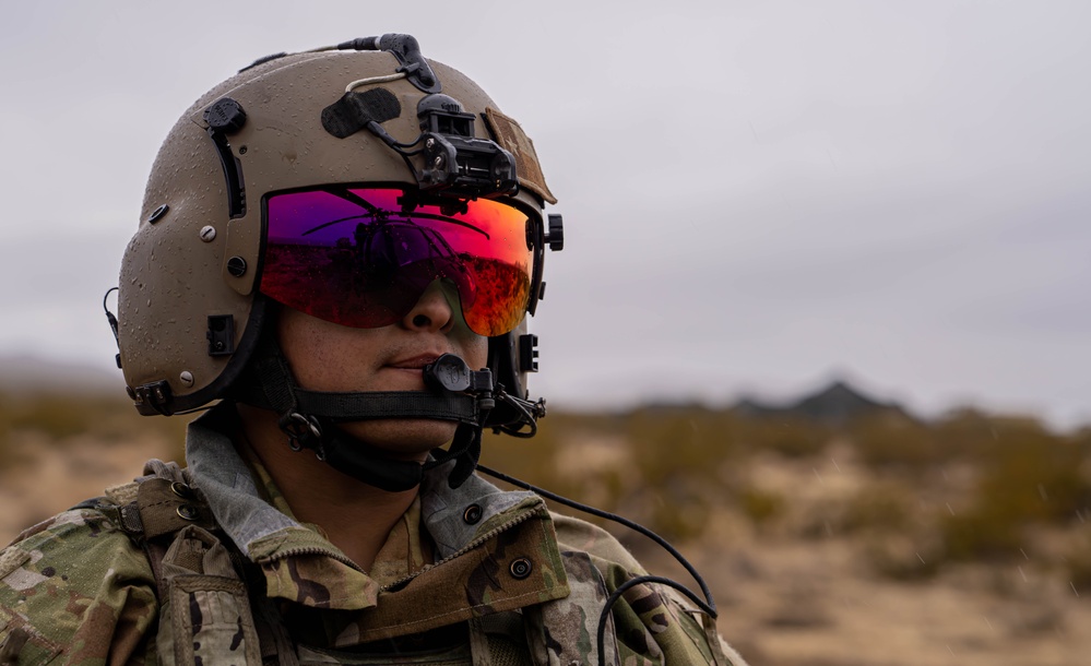 U.S. Army Door Gunner conducts pre-flight checks