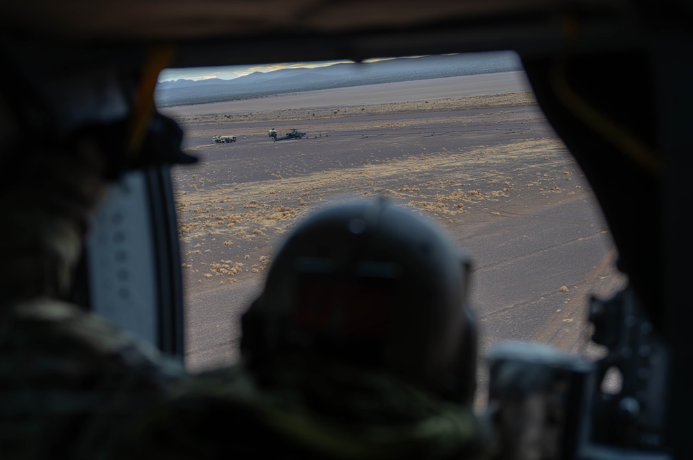 U.S. Army Crew Chief scans a landing zone