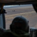 U.S. Army Crew Chief scans a landing zone