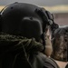 U.S. Army Crew Chief scans the desert