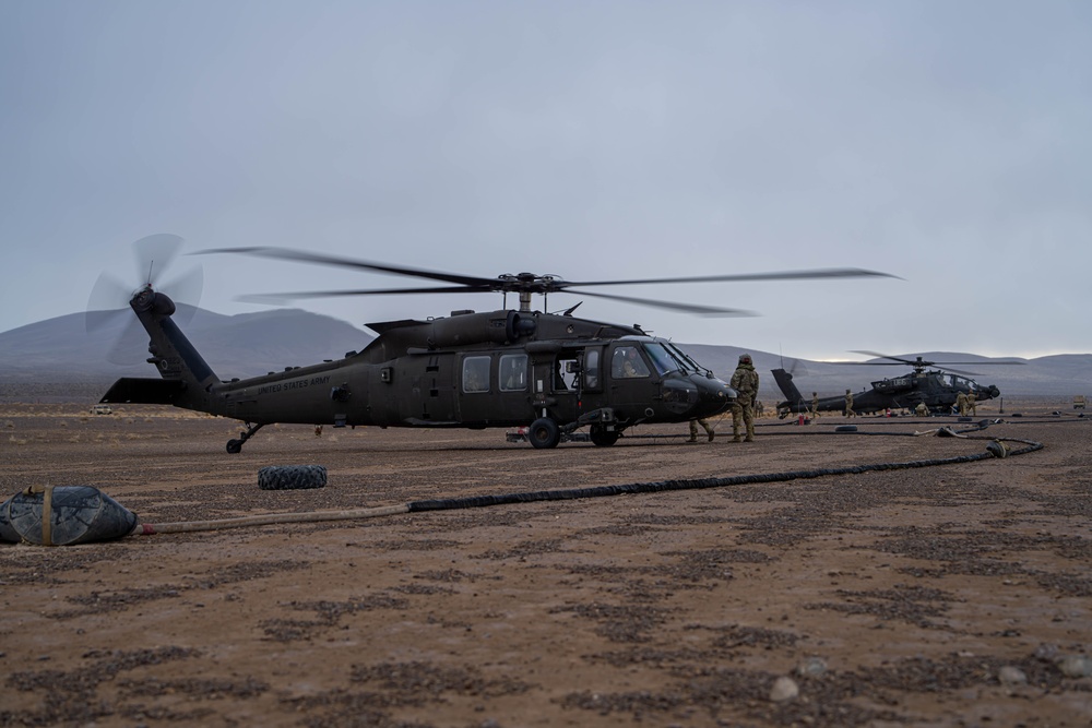 UH-60M Black Hawk and AH-64D Apache refuel