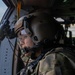 U.S. Army Door Gunner scans desert