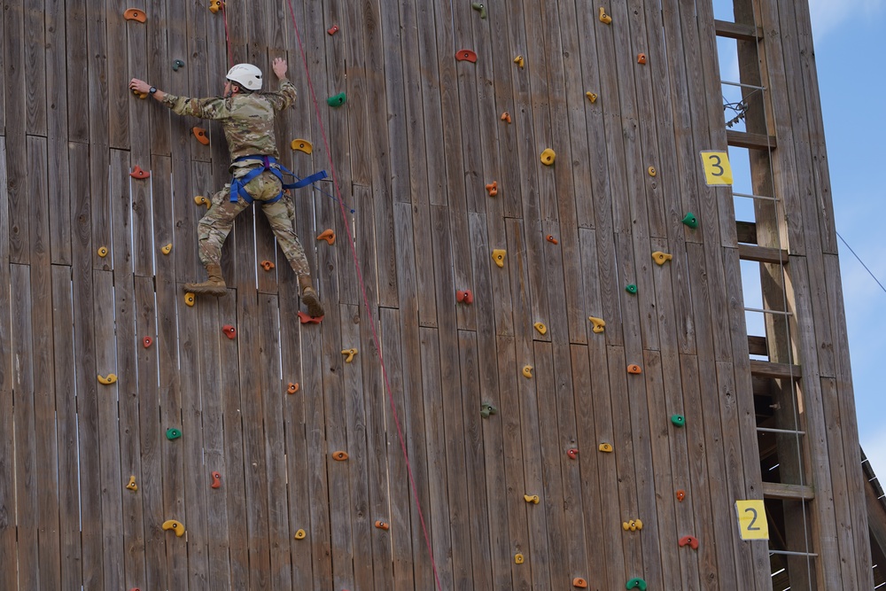 Soldier scaling rock wall