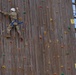 Soldier scaling rock wall