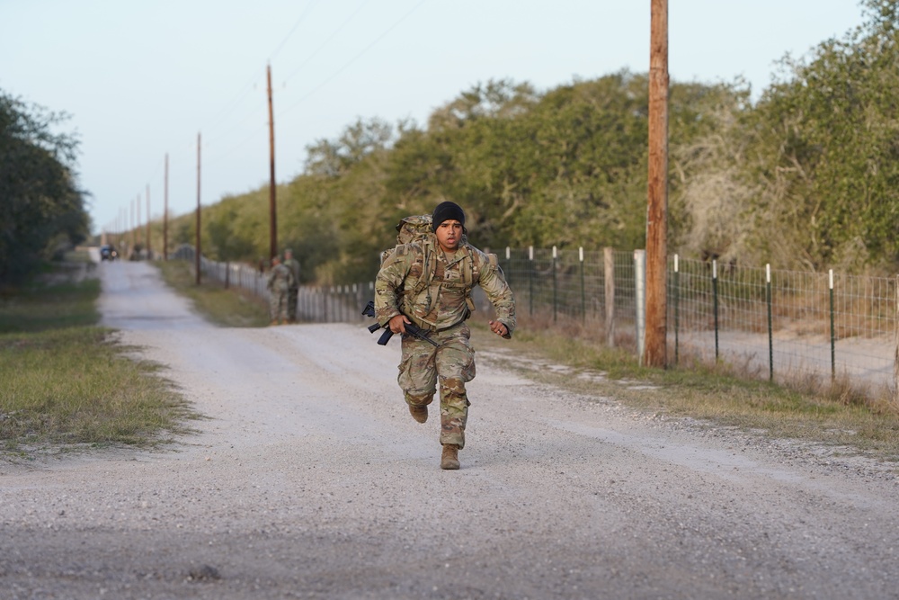 First Lt. Jose Montelongo runs while conducting a ruck march