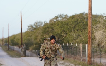 First Lt. Jose Montelongo runs while conducting a ruck march