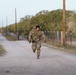 First Lt. Jose Montelongo runs while conducting a ruck march