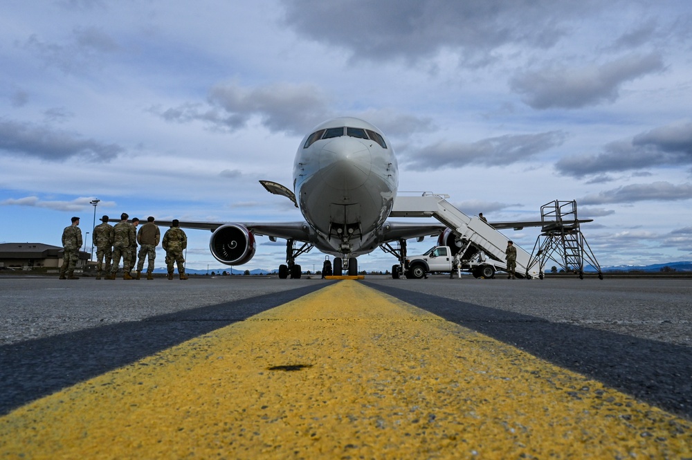 Airmen assigned to the 92nd Maintenance Group depart for deployment