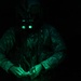 U.S. Army Crew Chief conducts pre-flight checks