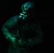 U.S. Army Crew Chief conducts pre-flight checks