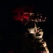 U.S. Army Flight Medics checks his night vision goggles