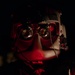 U.S. Army Flight Medics checks his night vision goggles