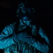 U.S. Army Crew Chief conducts pre-flight checks