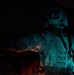 U.S. Army Crew Chief conducts pre-flight checks