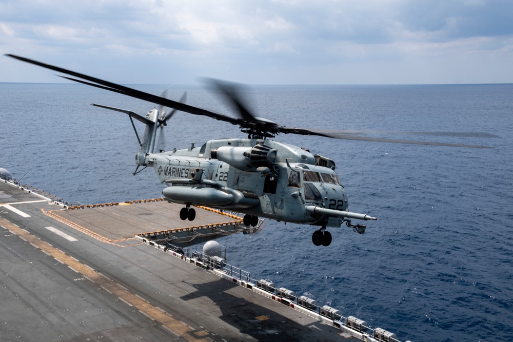 A CH-53E Super Stallion helicopter departs from USS America (LHA 6)