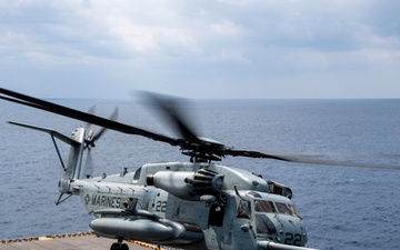 A CH-53E Super Stallion helicopter departs from USS America (LHA 6)