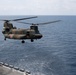 A CH-47 Chinook helicopter takes off from USS America (LHA 6)