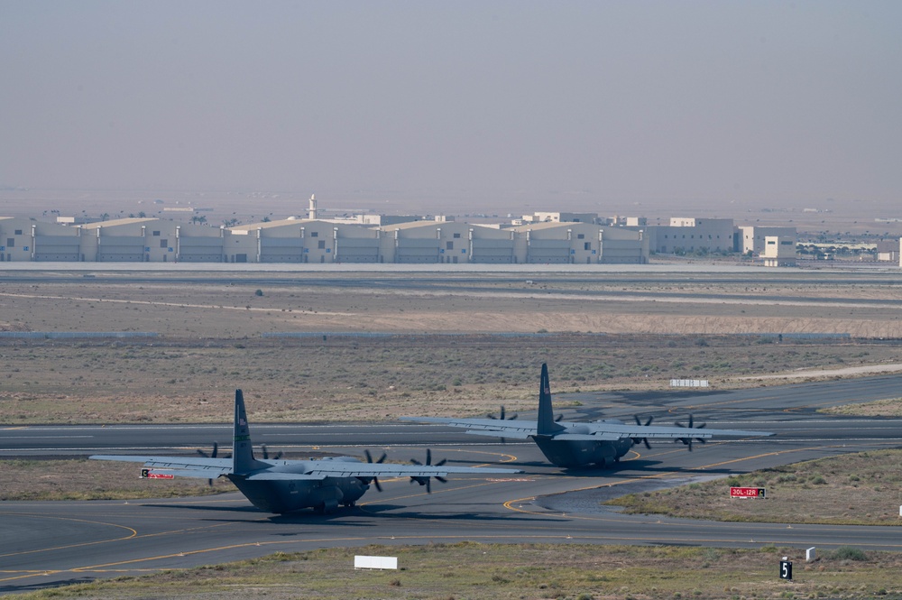 Airmen load AFCENT C-130s with humanitarian aid bound for Gaza