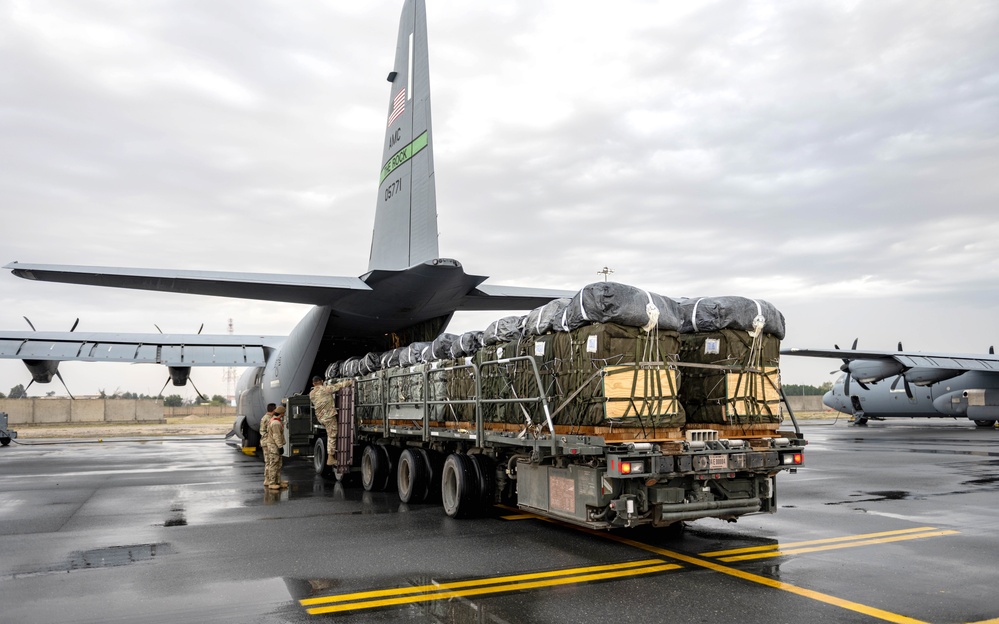 Airmen load AFCENT C-130s with humanitarian aid bound for Gaza