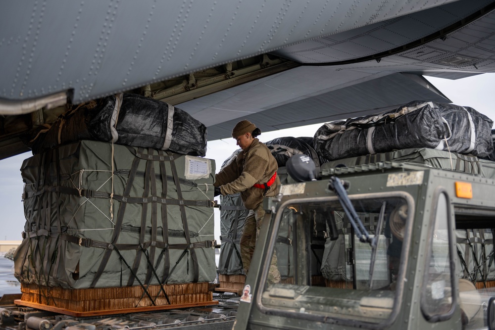 Airmen load AFCENT C-130s with humanitarian aid bound for Gaza