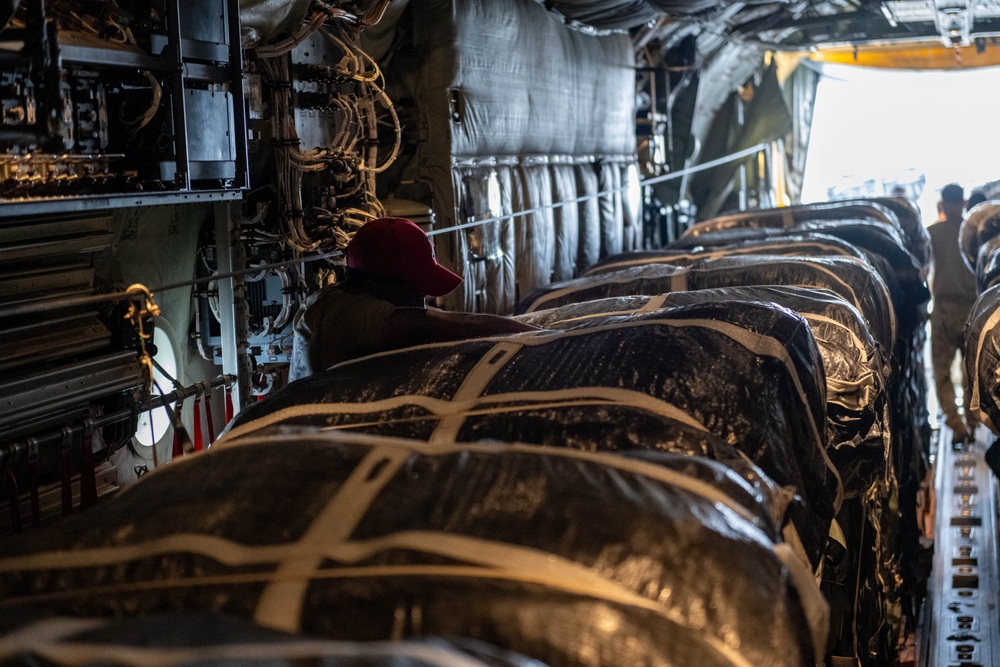 Airmen load AFCENT C-130s with humanitarian aid bound for Gaza