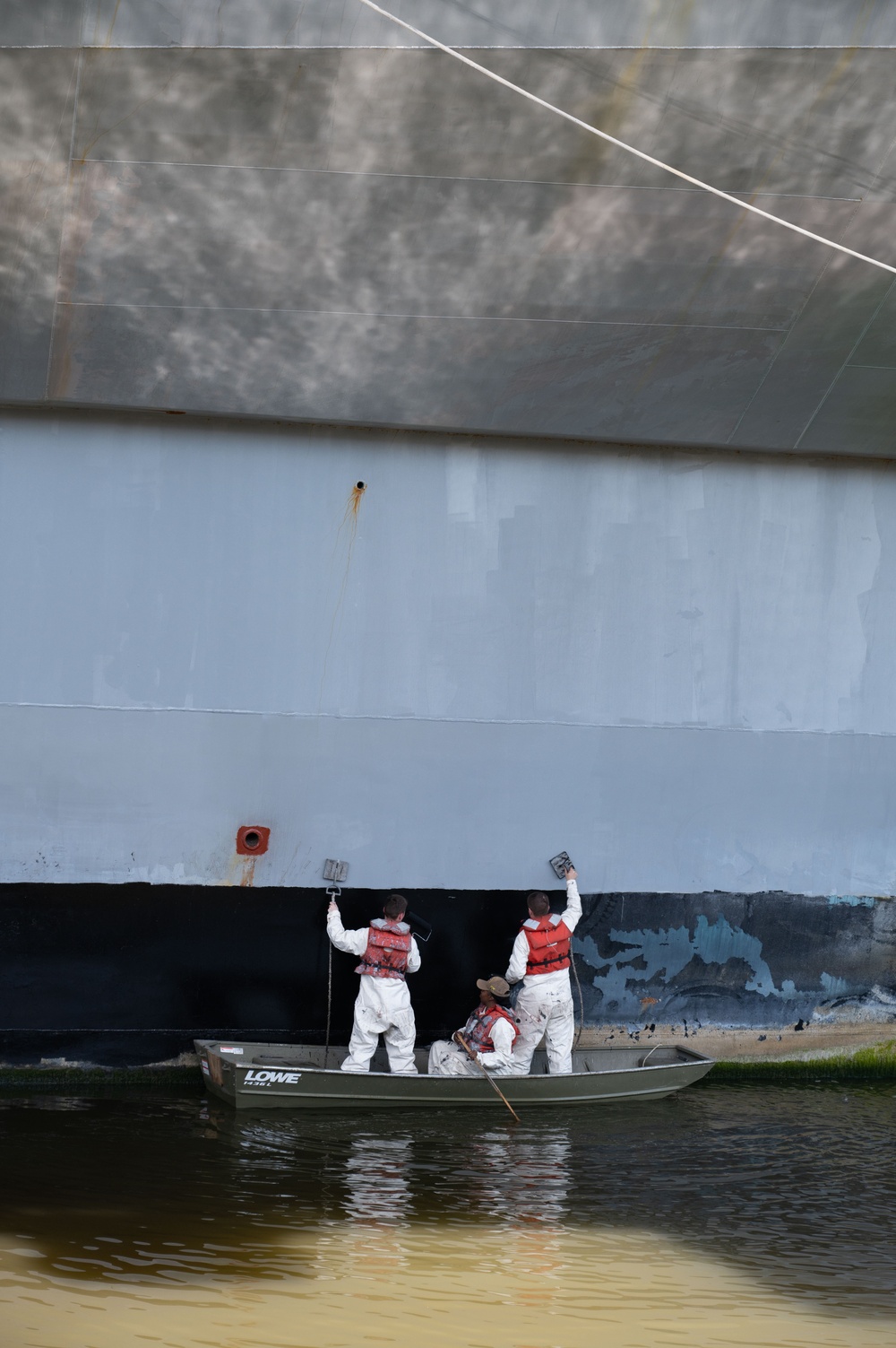 Sailors paint Ford's hull