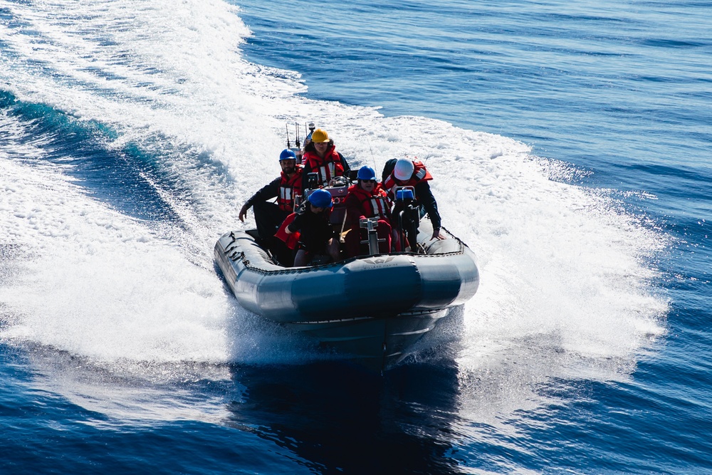 USS John S. McCain conduct small boat operations